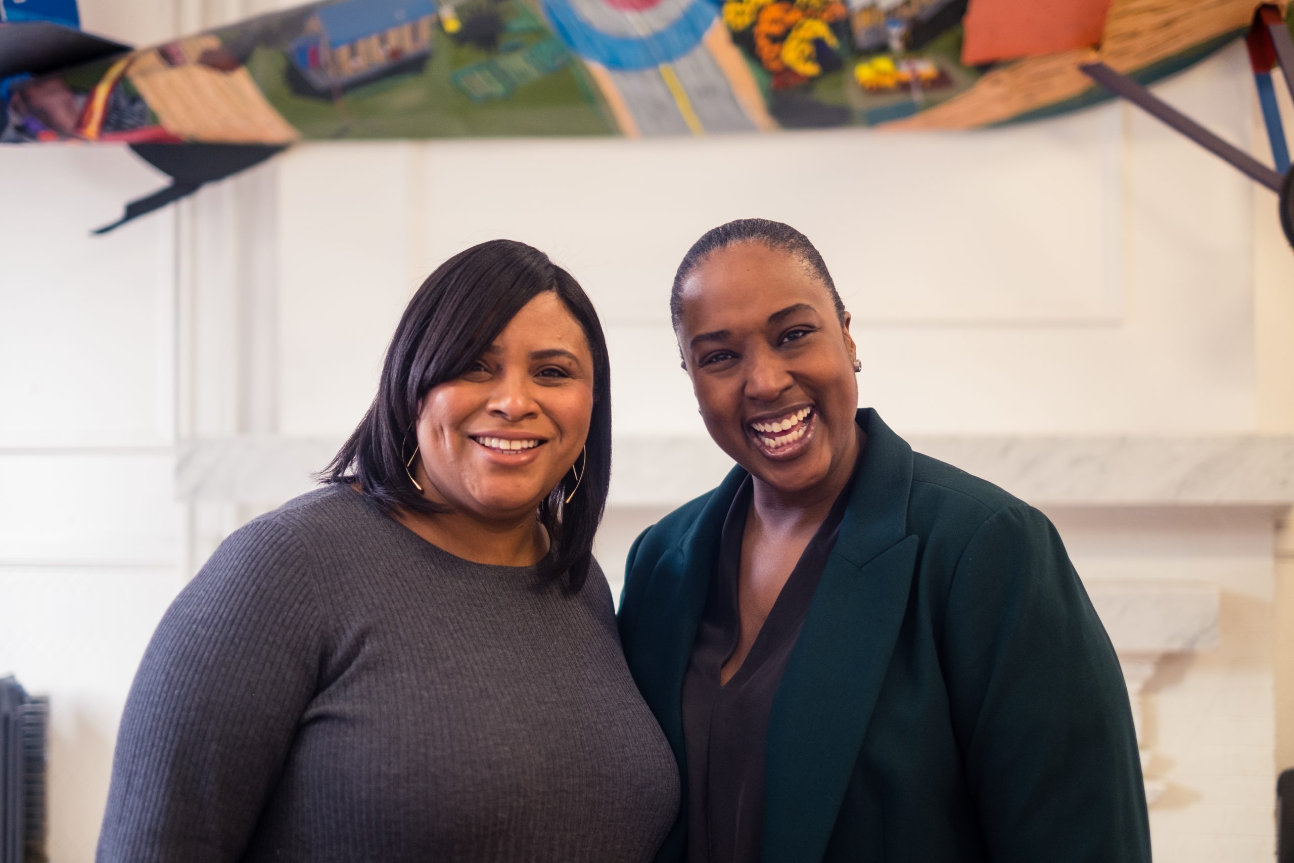 Jill Andrew and Aisha Fairclough portrait. Both of them smiling. 