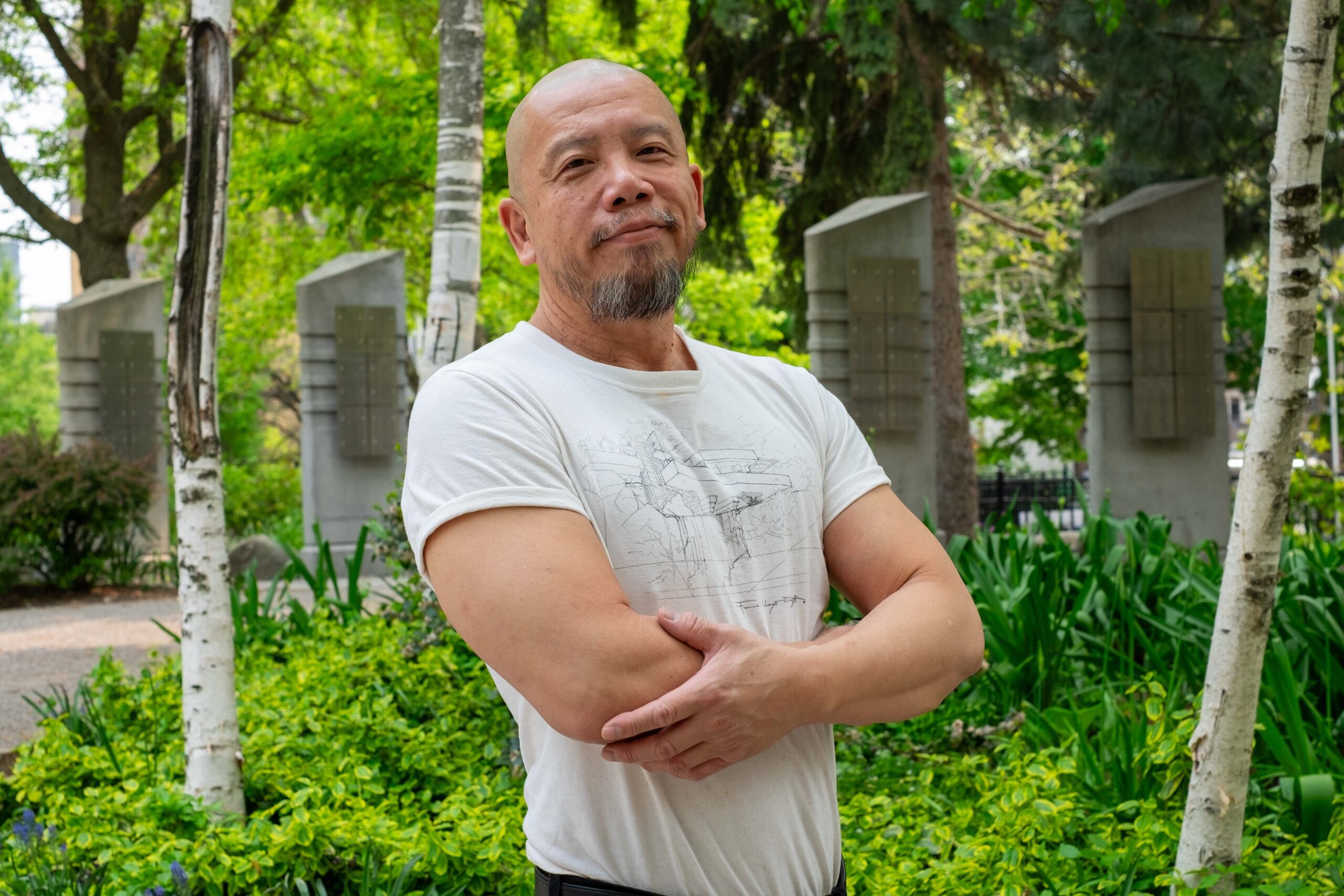 Patrick Fahn posing in front of the AIDS Memorial